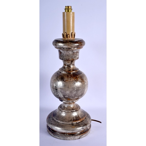 378 - AN ANTIQUE SILVERED CONTINENTAL WOOD CANDLESTICK LAMP. 49 cm high.