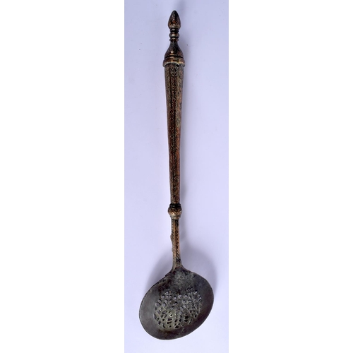 380 - A 19TH CENTURY MIDDLE EASTERN ISLAMIC TYPE HEATING SPOON decorated with foliage. 50 cm long.
