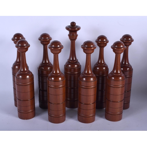 383 - A VERY UNUSUAL LATE VICTORIAN CARVED HARDWOOD SKITTLE SET within original fitted box. 33 cm x 29 cm.
