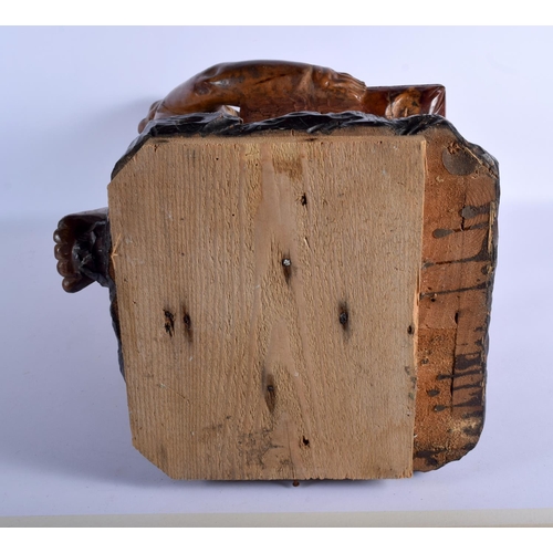 384 - AN 18TH/19TH CENTURY EUROPEAN CARVED WOOD FIGURE OF A KNEELING BOY modelled holding a pillow decorat... 