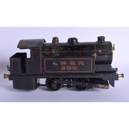 391 - AN ANTIQUE CARVED DOMINO SET together with a bowman tinplate train. Largest 24 cm long. (2)