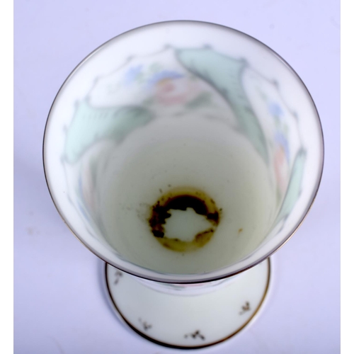 396 - A VINTAGE BOHEMIAN GLASS GOBLET painted with flowers. 18 cm high.