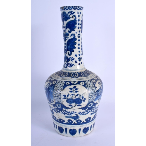 397 - AN 18TH CENTURY DUTCH TIN GLAZED DELFT BLUE AND WHITE BOTTLE VASE painted with figures. 29 cm high.