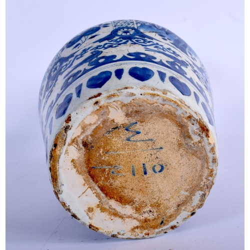 397 - AN 18TH CENTURY DUTCH TIN GLAZED DELFT BLUE AND WHITE BOTTLE VASE painted with figures. 29 cm high.