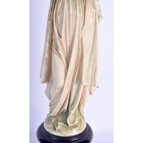 406 - A LARGE 19TH CENTURY EUROPEAN DIEPPE POLYCHROMED IVORY FIGURE OF A SAINT modelled with hands clasped... 