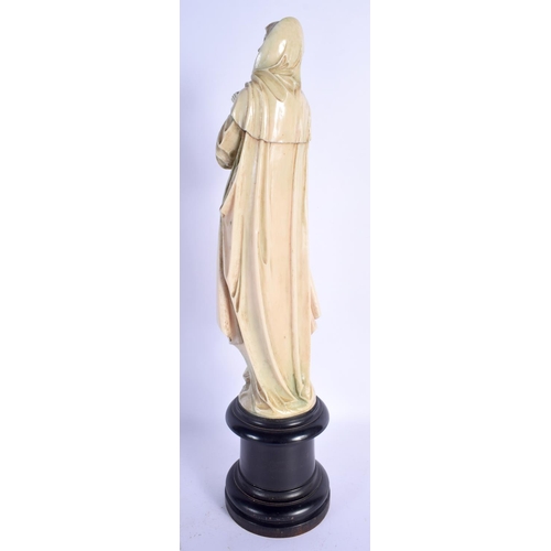406 - A LARGE 19TH CENTURY EUROPEAN DIEPPE POLYCHROMED IVORY FIGURE OF A SAINT modelled with hands clasped... 