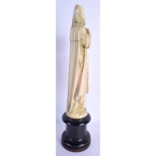 406 - A LARGE 19TH CENTURY EUROPEAN DIEPPE POLYCHROMED IVORY FIGURE OF A SAINT modelled with hands clasped... 