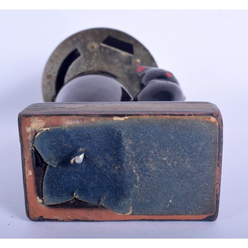 41 - A RARE VINTAGE EVANUS POTTERY CAT TABLE LIGHTER modelled beside a lamp. 14 cm x 7 cm.