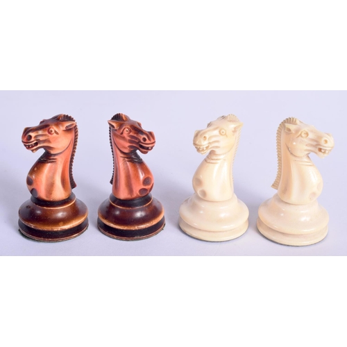 411 - A FINE EARLY 19TH CENTURY CONTINENTAL CARVED AND STAINED IVORY CHESS SET within an antique wooden bo... 