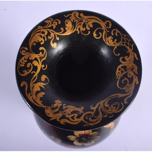 414 - A LARGE EARLY VICTORIAN BLACK LACQUER VASE painted with a bird amongst foliage. 27 cm high.