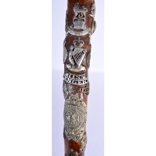 417 - AN UNUSUAL VINTAGE MILITARY FOLK ART TYPE EAGLE HEAD WALKING CANE of almost cermonial axe head form.... 