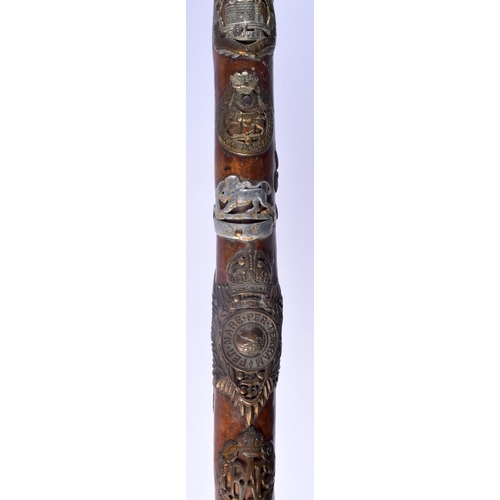 417 - AN UNUSUAL VINTAGE MILITARY FOLK ART TYPE EAGLE HEAD WALKING CANE of almost cermonial axe head form.... 