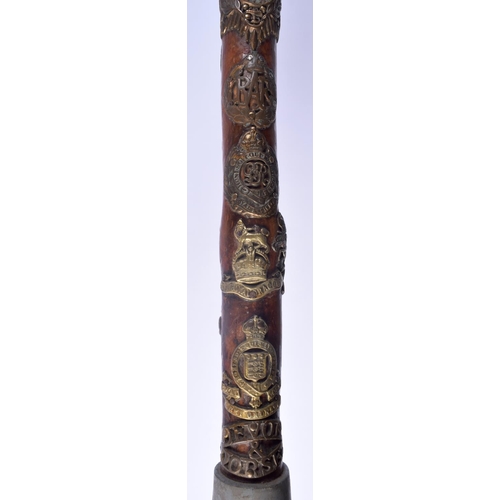 417 - AN UNUSUAL VINTAGE MILITARY FOLK ART TYPE EAGLE HEAD WALKING CANE of almost cermonial axe head form.... 