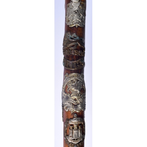 417 - AN UNUSUAL VINTAGE MILITARY FOLK ART TYPE EAGLE HEAD WALKING CANE of almost cermonial axe head form.... 