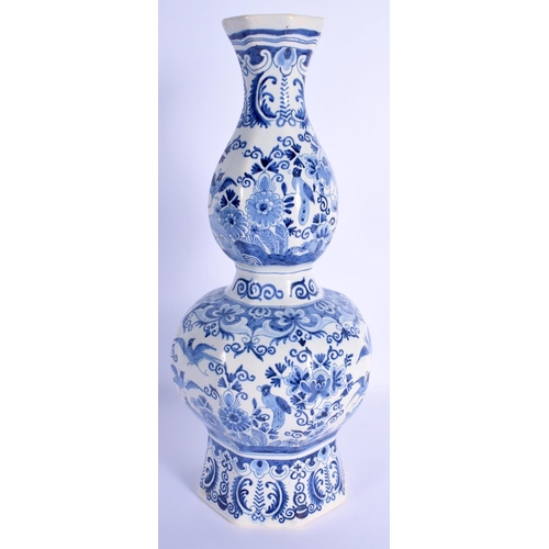 42 - A LARGE DUTCH DELFT BLUE AND WHITE PORCELAIN VASE of hexagonal form, painted with birds and landscap... 
