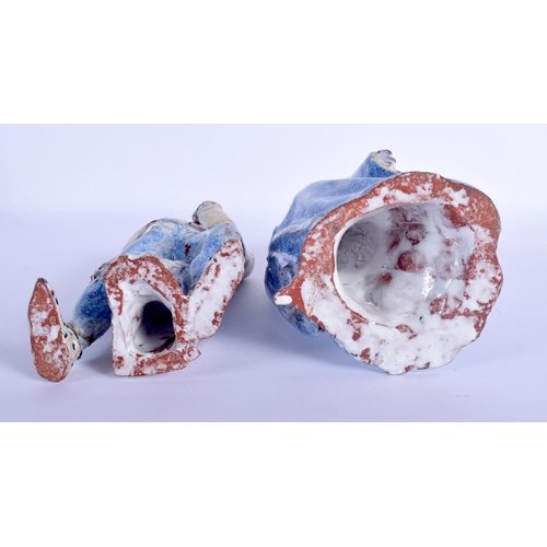 43 - A PAIR OF CONTINENTAL FAIENCE GLAZED POTTERY FIGURES modelled as theatrical characters. 22 cm high.