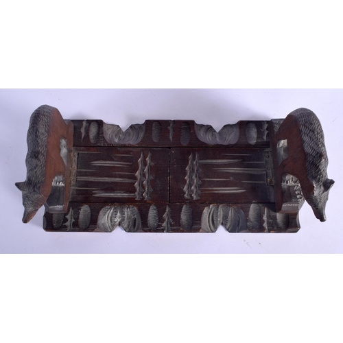 431 - AN EARLY 20TH CENTURY BAVARIAN BLACK FOREST SLIDING BOOK RACK formed as standing bears. 44 cm x 12 c... 