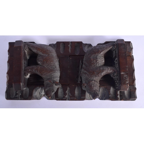 431 - AN EARLY 20TH CENTURY BAVARIAN BLACK FOREST SLIDING BOOK RACK formed as standing bears. 44 cm x 12 c... 