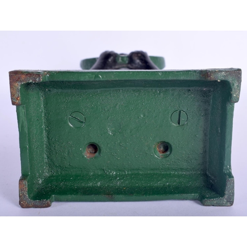 435 - A CHARMING VINTAGE CAST IRON MONEY BANK modelled as a young boy munching on a water melon. 25 cm hig... 