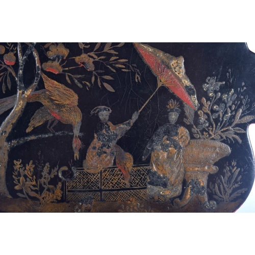 443 - A GEORGE III COUNTRY HOUSE BLACK LACQUER FAN decorated with Chinese figures, together with a painted... 