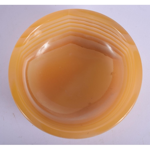 448 - AN EARLY 20TH CENTURY MIDDLE EASTERN CARVED AGATE CIRCULAR BOWL of naturalistic form. 11 cm diameter... 