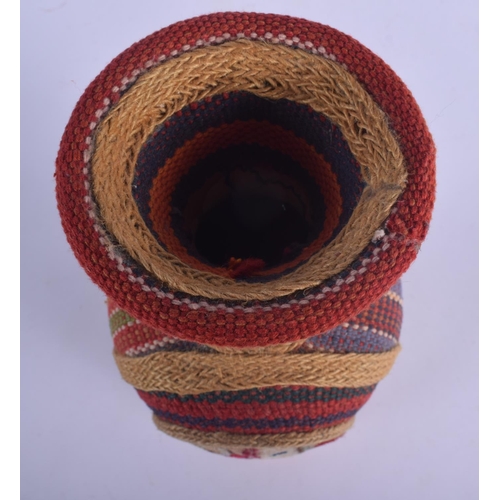 449 - AN EARLY 20TH CENTURY SOUTH AMERICAN OVERLAID POTTERY VASE decorated with motifs. 29 cm high.