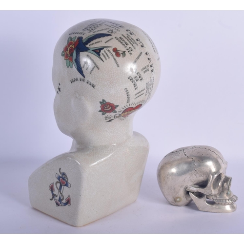 452 - A CONTEMPORARY POTTERY PHRENOLOGY HEAD together with a silvered bronze model of a skull. Largest 30 ... 