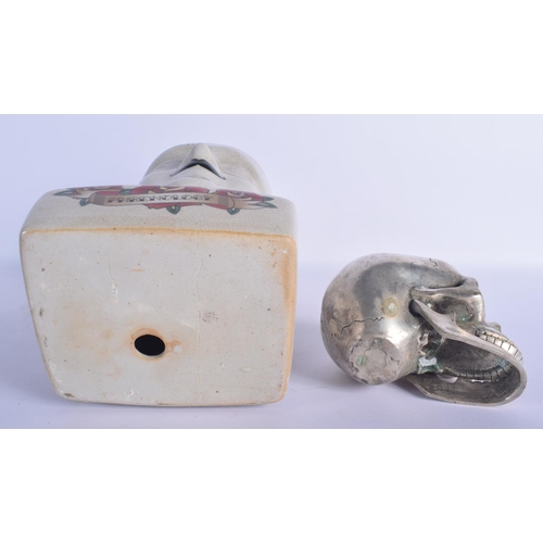 452 - A CONTEMPORARY POTTERY PHRENOLOGY HEAD together with a silvered bronze model of a skull. Largest 30 ... 