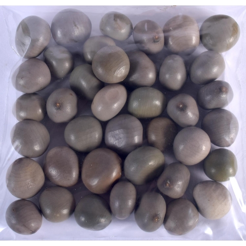 454 - AN UNUSUAL VINTAGE TRIBAL CARVED WOOD MANCALA GAMING BOARD with carved nut counters. Board 50 cm x 1... 