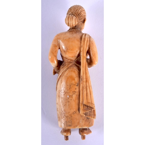 459 - AN 18TH CENTURY ANGLO INDIAN CARVED IVORY FIGURE OF A FEMALE modelled holding a baby. 8.5 cm high.