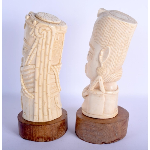 468 - A RARE PAIR OF EARLY 20TH CENTURY AFRICAN TRIBAL CARVED IVORY BUSTS C1910 modelled as a King and Que... 