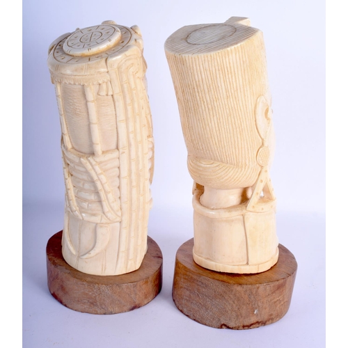 468 - A RARE PAIR OF EARLY 20TH CENTURY AFRICAN TRIBAL CARVED IVORY BUSTS C1910 modelled as a King and Que... 