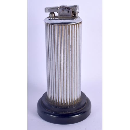 471 - A 1950S SILVER PLATED PATENT POLO GENTLEMANS CLUB LIGHTER with bakelite base. 14 cm high.