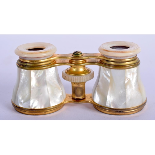472 - A PAIR OF ANTIQUE MOTHER OF PEARL BINOCULARS with leather case. 9 cm x 6.5 cm extended.