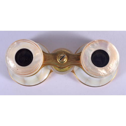 472 - A PAIR OF ANTIQUE MOTHER OF PEARL BINOCULARS with leather case. 9 cm x 6.5 cm extended.