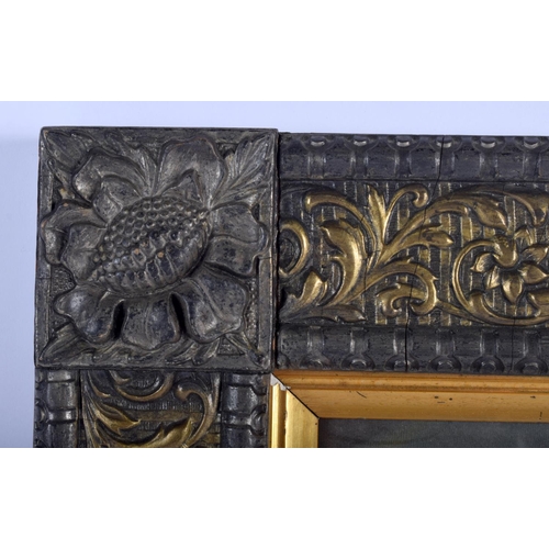 478 - AN ANTIQUE ITALIAN FLORENTINE CARVED WOOD FRAME containing an engraving of children. 45 cm x 37 cm.