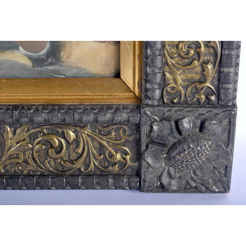 478 - AN ANTIQUE ITALIAN FLORENTINE CARVED WOOD FRAME containing an engraving of children. 45 cm x 37 cm.