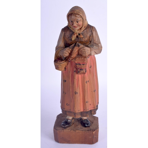 480 - A VINTAGE BLACK FOREST MUSICAL CLOCK together with a Bavarian figure & a corpus christi. Largest 40 ... 
