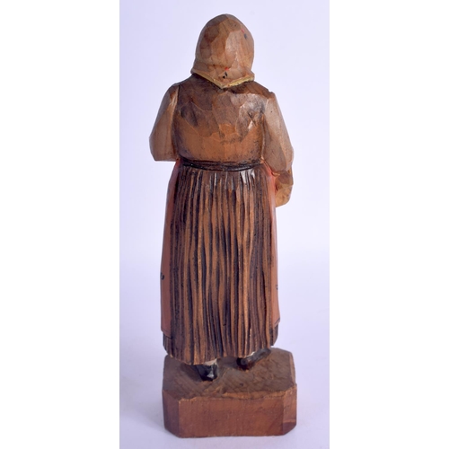 480 - A VINTAGE BLACK FOREST MUSICAL CLOCK together with a Bavarian figure & a corpus christi. Largest 40 ... 