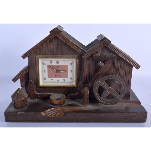 480 - A VINTAGE BLACK FOREST MUSICAL CLOCK together with a Bavarian figure & a corpus christi. Largest 40 ... 