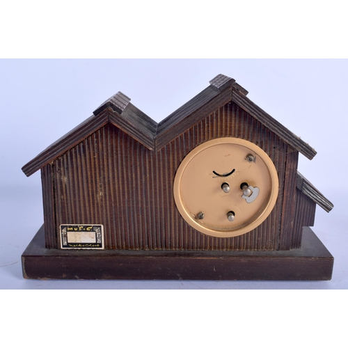 480 - A VINTAGE BLACK FOREST MUSICAL CLOCK together with a Bavarian figure & a corpus christi. Largest 40 ... 