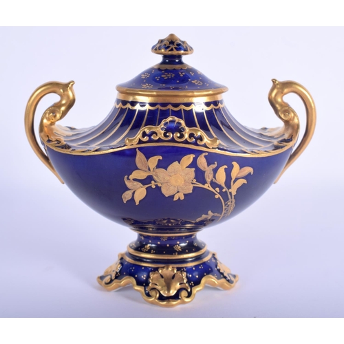 52 - A ROYAL CROWN DERBY TWIN HANDLED VASE AND COVER enamelled with gilded flowers. 13 cm x 12 cm.