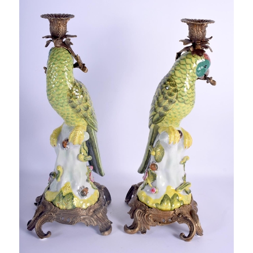 73 - A LARGE PAIR OF CONTEMPORARY PARROT GILT METAL CANDLESTICKS. 36 cm high.