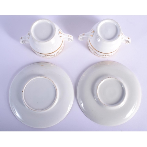 8 - A PAIR OF EARLY 19TH CENTURY TWIN HANDLED GILDED CUPS AND SAUCERS Coalport or Derby, painted with ne... 