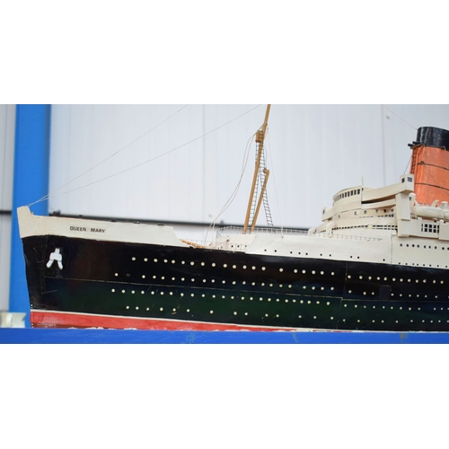 433 - A VERY LARGE MID 20TH CENTURY PAINTED SCRATCH BUILT MODEL BOAT OF THE QUEEN MARY modelled upon a pai... 