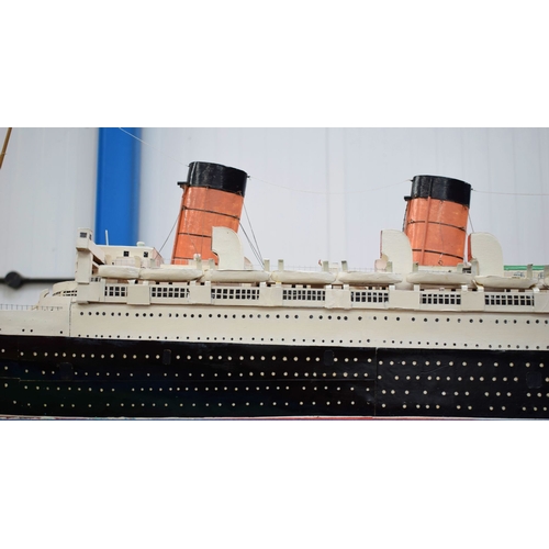 433 - A VERY LARGE MID 20TH CENTURY PAINTED SCRATCH BUILT MODEL BOAT OF THE QUEEN MARY modelled upon a pai... 