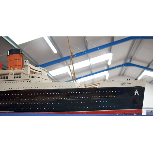433 - A VERY LARGE MID 20TH CENTURY PAINTED SCRATCH BUILT MODEL BOAT OF THE QUEEN MARY modelled upon a pai... 