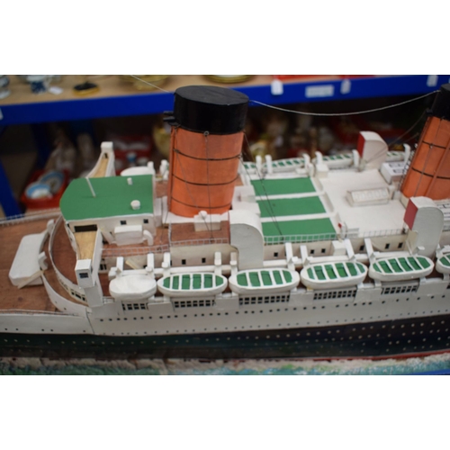 433 - A VERY LARGE MID 20TH CENTURY PAINTED SCRATCH BUILT MODEL BOAT OF THE QUEEN MARY modelled upon a pai... 