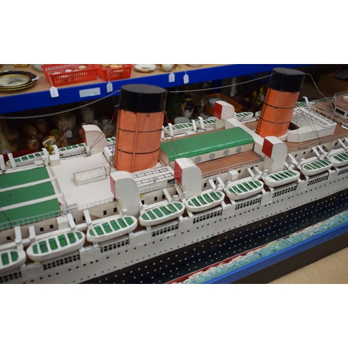 433 - A VERY LARGE MID 20TH CENTURY PAINTED SCRATCH BUILT MODEL BOAT OF THE QUEEN MARY modelled upon a pai... 