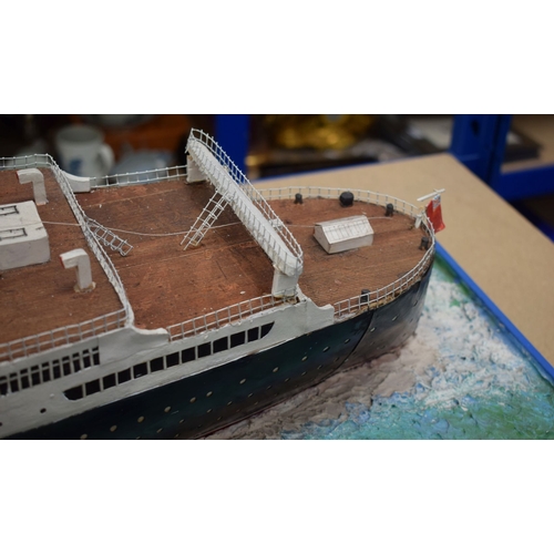 433 - A VERY LARGE MID 20TH CENTURY PAINTED SCRATCH BUILT MODEL BOAT OF THE QUEEN MARY modelled upon a pai... 